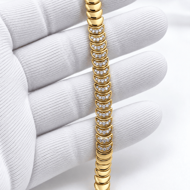 Bhavmayi golden link bracelet with curved embellished motifs, geometric clear accents and a visible clasp