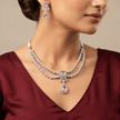 Bhavmayi rose gold-tone layered necklace set with pink square and teardrop accents and matching earrings - bhavmayi