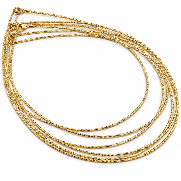 Golden multi-strand necklace with fine twisted textured chains and a layered appearance