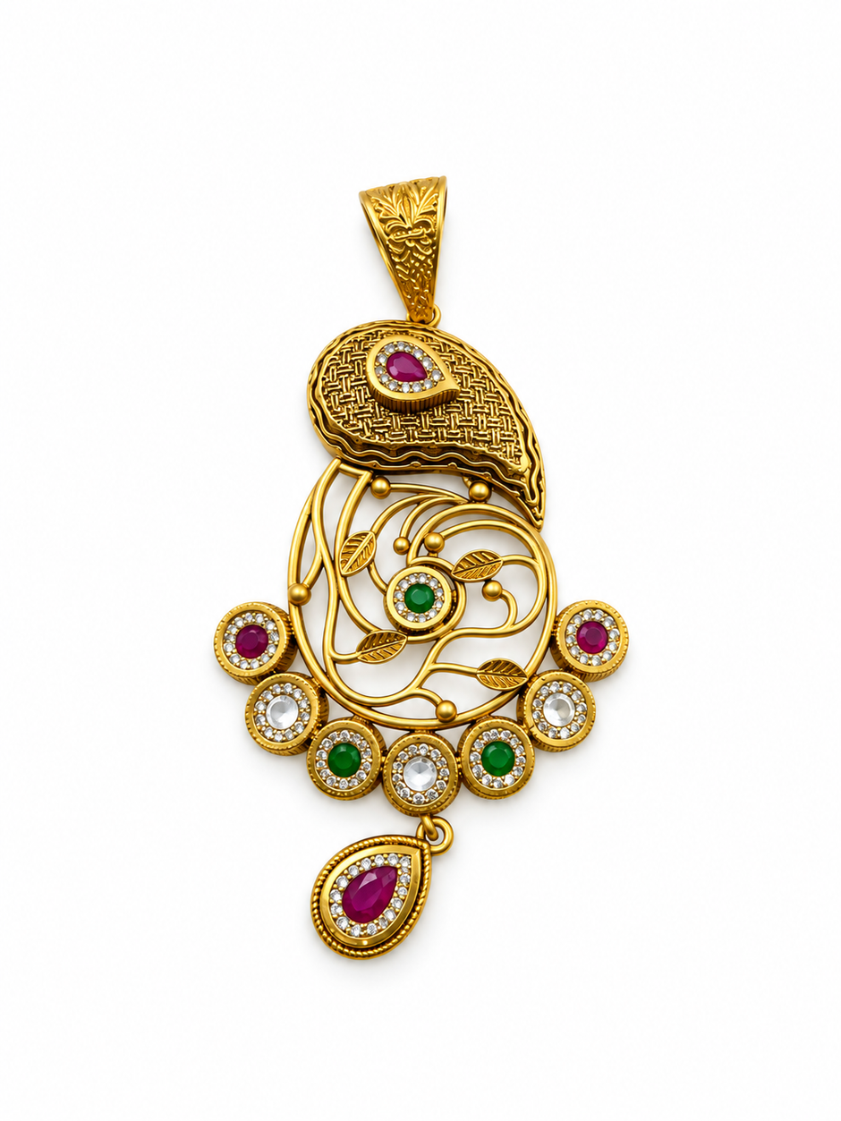 Gold-tone ornamental pendant and matching drop earrings displayed on a cream background, featuring intricate golden patterns, magenta-pink accents, green teardrop-shaped drops, and white decorative details.