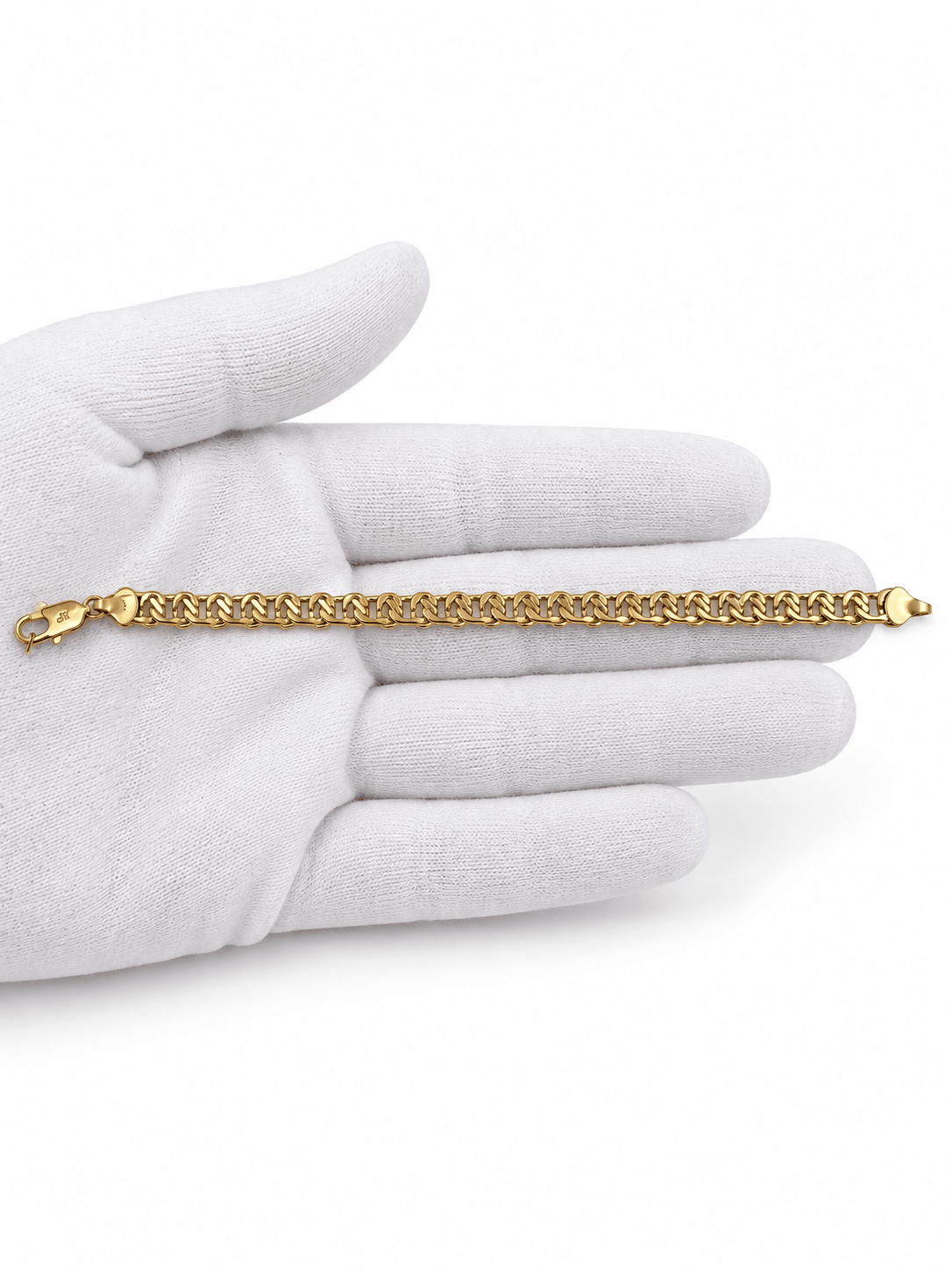 Gold-tone bracelet featuring a continuous chain of rounded interlocking links with a twisted appearance, shown separately and worn around a woman's wrist. - bhavmayi