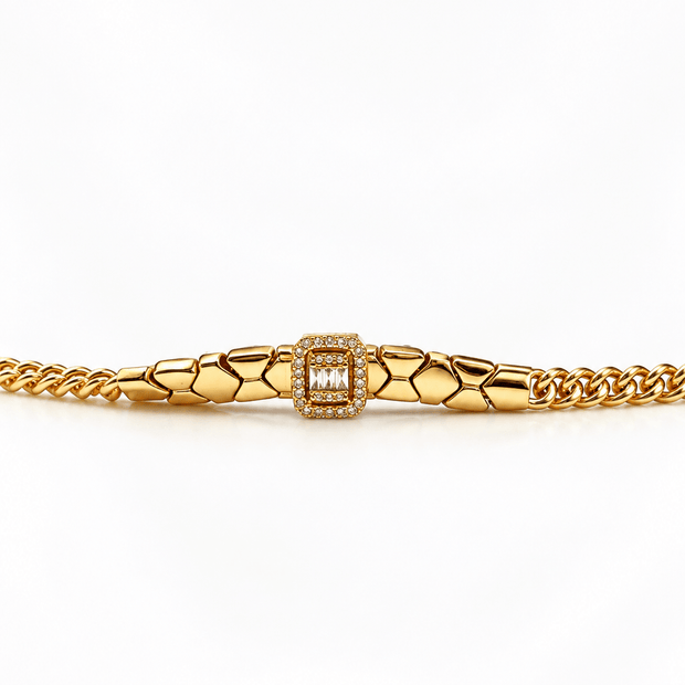 Golden-toned link bracelet with geometric links and a rectangular centrepiece decorated with clear sparkling accents