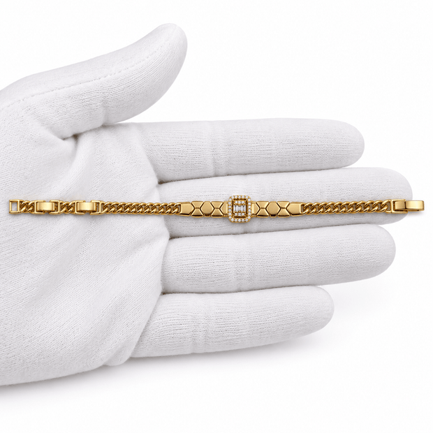 Golden-toned link bracelet with geometric links and a rectangular centrepiece decorated with clear sparkling accents