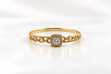 Gold-tone bracelet with a square-shaped central motif, large clear faceted centrepiece, surrounding rows of small clear decorative stones and an intricate openwork linked band. - bhavmayi