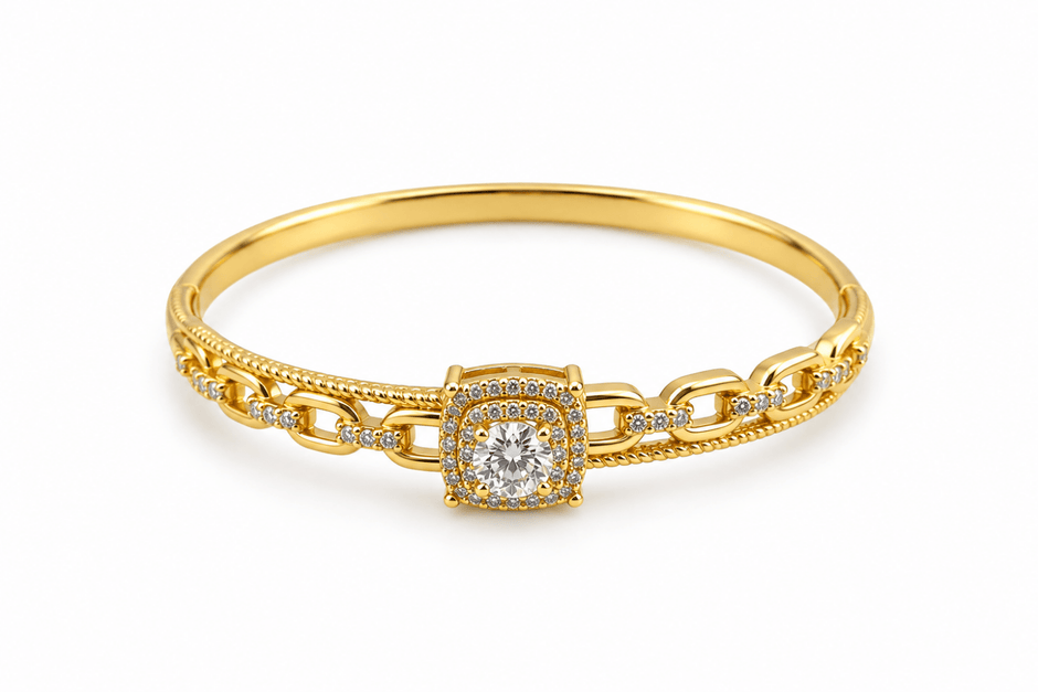Gold-tone bracelet with a square-shaped central motif, large clear faceted centrepiece, surrounding rows of small clear decorative stones and an intricate openwork linked band. - bhavmayi