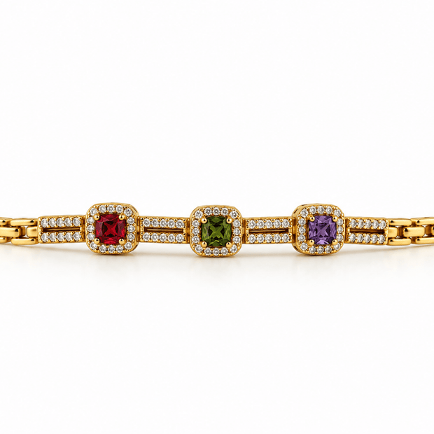 Golden link bracelet with three coloured centre accents and clear decorative detailing