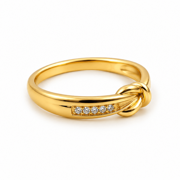 Bhavmayi golden knot design ring with a row of clear accent details shown on a finger