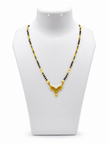 Gold-tone mangalsutra necklace with black bead chain, symmetrical leaf-shaped centerpiece, clear stone embellishments and a decorative central drop detail, displayed on a white background. - bhavmayi