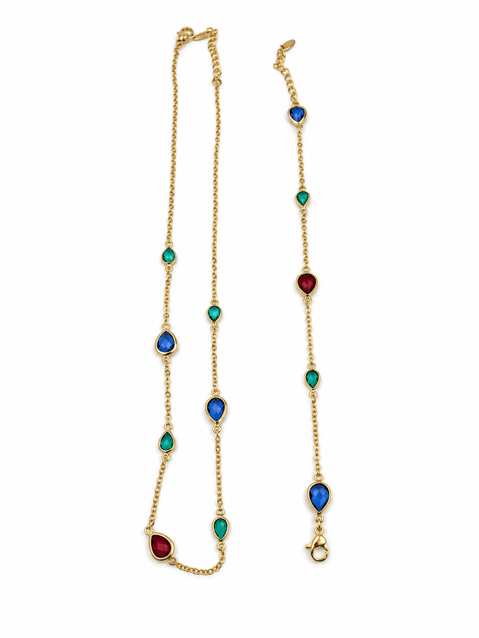 Gold-tone necklace and matching bracelet featuring delicate chains with spaced blue, teal green and burgundy red decorative accents, displayed on a model and separately. - bhavmayi