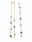 Gold-tone necklace and matching bracelet featuring delicate chains with spaced blue, teal green and burgundy red decorative accents, displayed on a model and separately. - bhavmayi