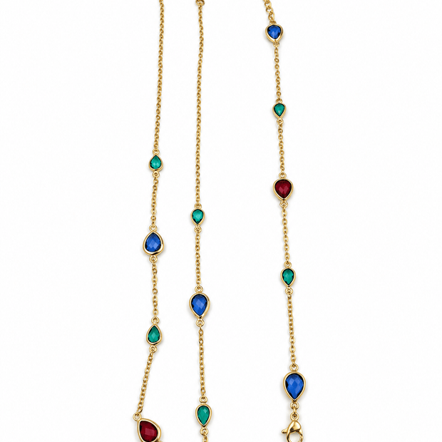 Gold-tone necklace and matching bracelet featuring delicate chains with spaced blue, teal green and burgundy red decorative accents, displayed on a model and separately. - bhavmayi