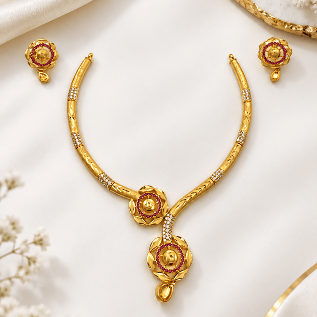 Bhavmayi golden-toned floral necklace and matching earrings with red accent circles and clear decorative details