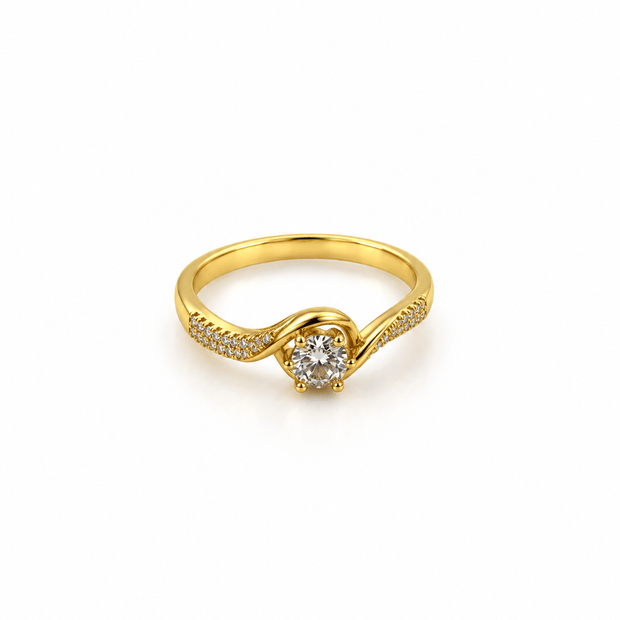 Gold-tone ring with a round floral arrangement of clear stones, curved golden detailing and small clear accents along the band, shown on a white background and worn on a finger. - bhavmayi