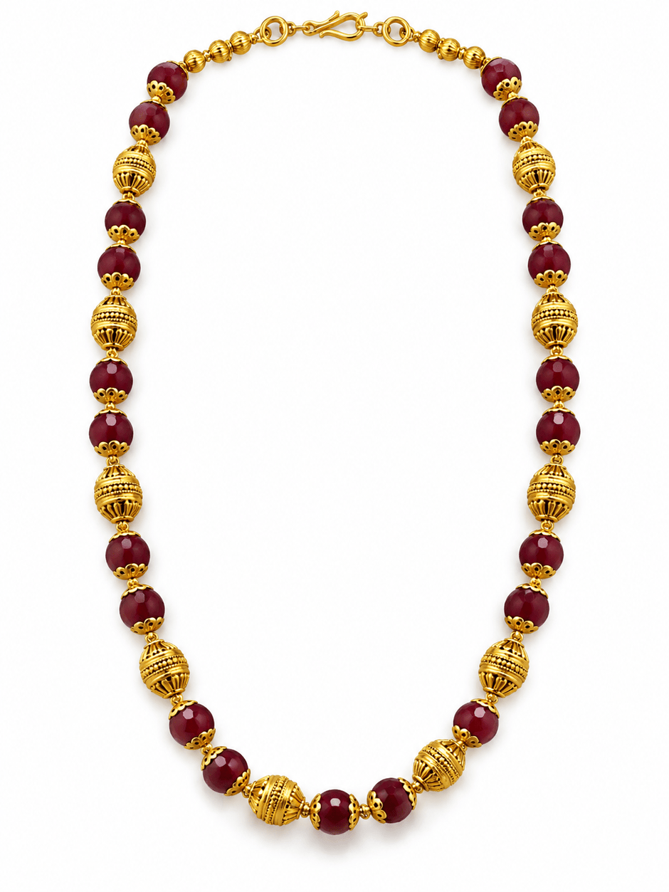 Long maroon beaded necklace with glossy rounded beads, ornate gold-tone barrel-shaped beads, floral-style bead caps and a hook-style clasp, shown from two angles. - bhavmayi