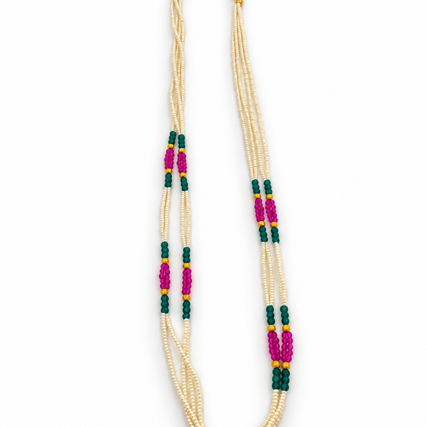 Bhavmayi triple-strand necklace with ivory-white beads, dark green and magenta-pink bead clusters, and gold-tone.