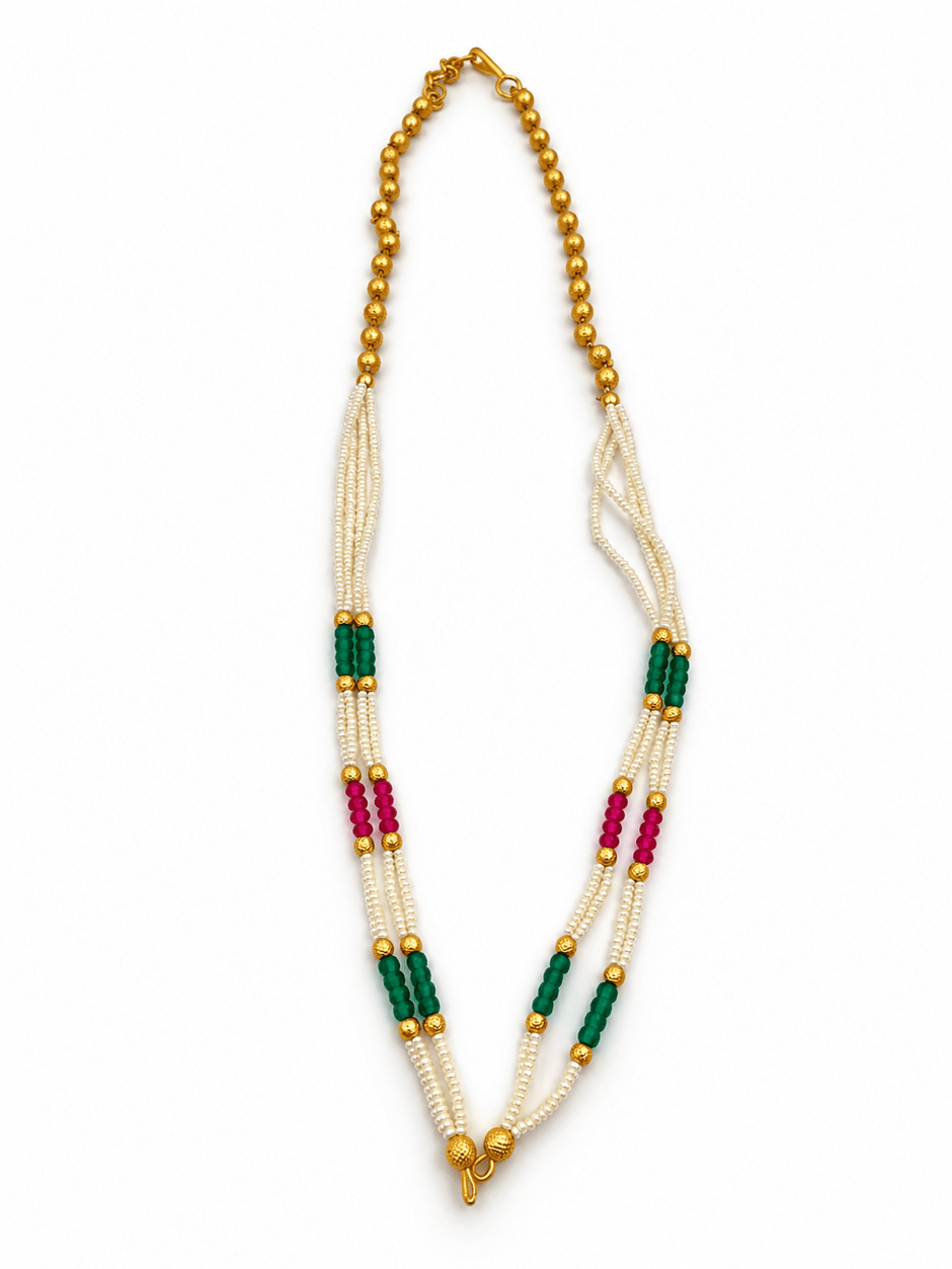 Long multistrand ivory-white pearl-style necklace featuring round gold-tone beads, green and magenta bead sections, and a gold-tone hook clasp, shown from two angles. - bhavmayi