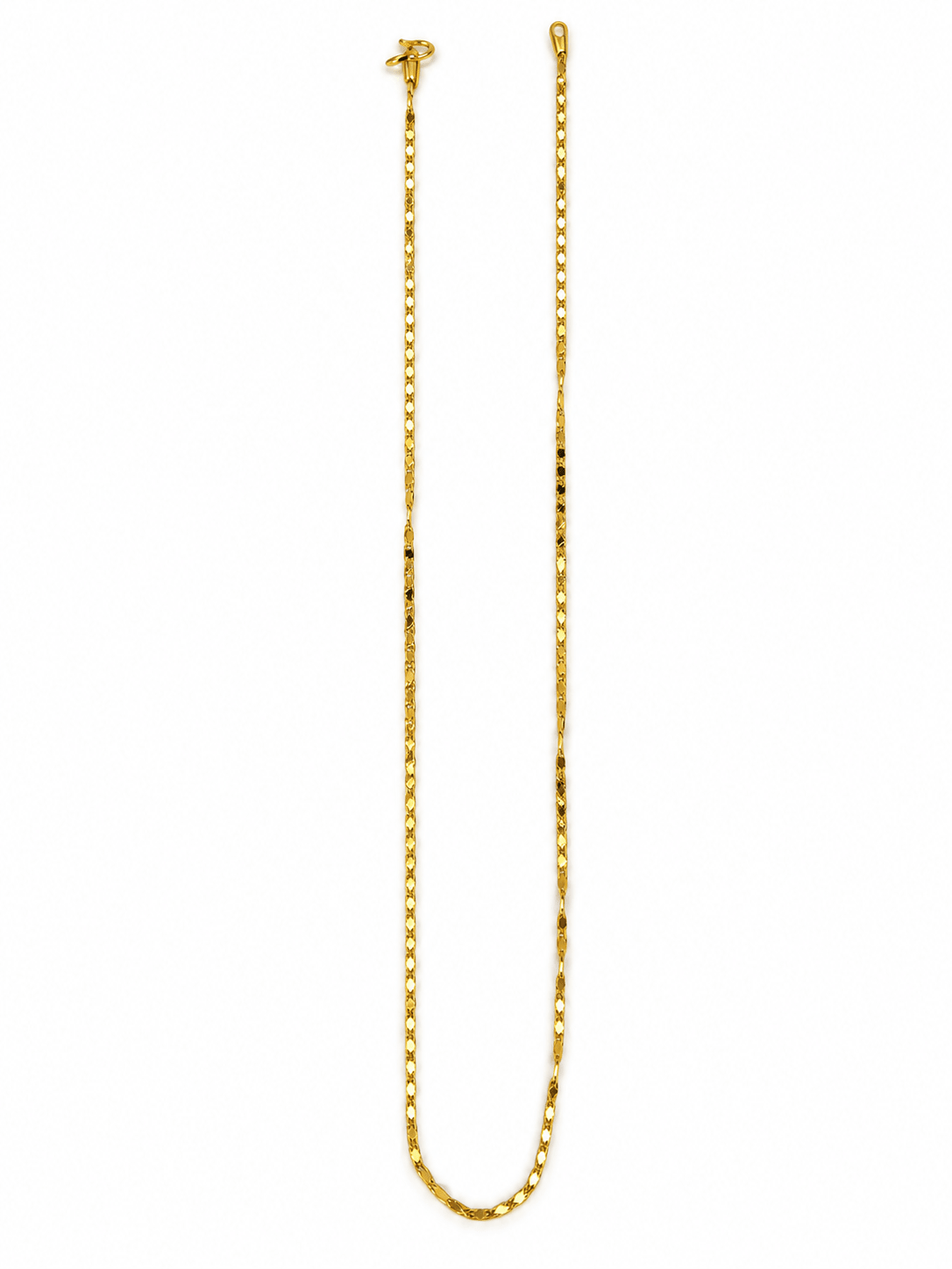Slender golden chain necklace with repeating small geometric links displayed in a U shape and on a white necklace bust. - bhavmayi