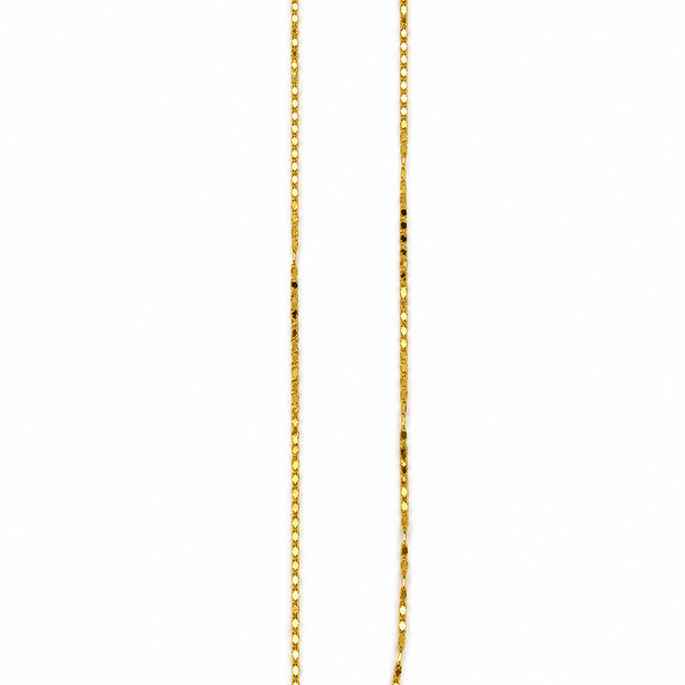 Delicate yellow gold-tone chain necklace with a repeating textured link pattern, on a white necklace stand by Bhavmayi.